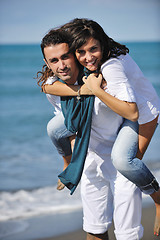 Image showing happy young couple have fun at beautiful beach