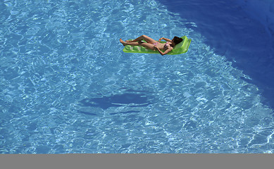 Image showing woman relax at swimming pool 