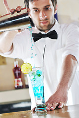 Image showing pro barman prepare coctail drink on party