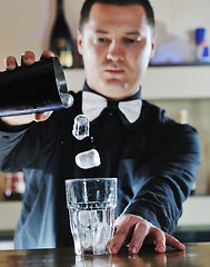 Image showing pro barman prepare coctail drink on party