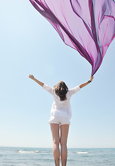 Image showing beautiful young woman on beach with scarf