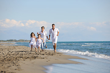 Image showing happy young  family have fun on beach