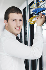 Image showing young it engeneer in datacenter server room