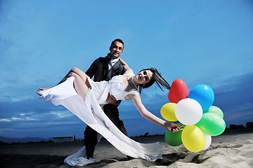 Image showing romantic beach wedding at sunset