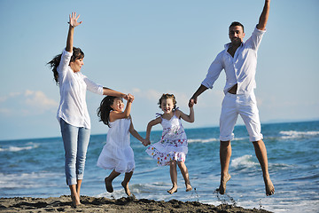 Image showing happy young  family have fun on beach