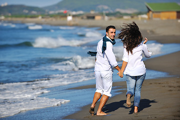 Image showing happy young couple have fun at beautiful beach