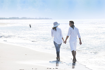 Image showing happy young couple have fun at beautiful beach