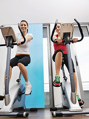 Image showing womanworkout  in fitness club on running track machine 