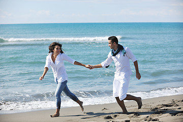 Image showing happy young couple have fun at beautiful beach