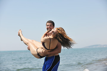 Image showing happy young couple have fun on beach