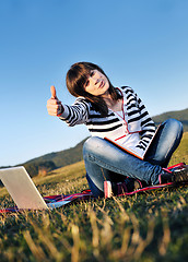 Image showing young teen girl work on laptop outdoor