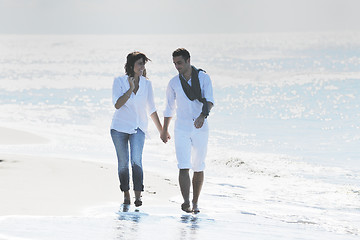 Image showing happy young couple have fun at beautiful beach