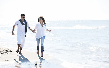 Image showing happy young couple have fun at beautiful beach