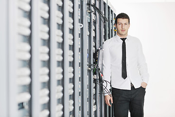 Image showing young it engeneer in datacenter server room