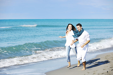 Image showing happy young couple have fun at beautiful beach