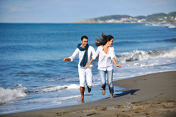 Image showing happy young couple have fun at beautiful beach