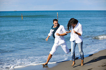 Image showing happy young couple have fun at beautiful beach