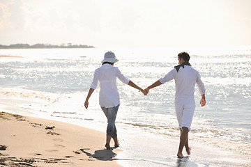 Image showing happy young couple have fun at beautiful beach