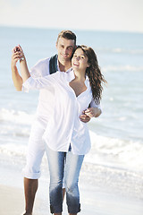 Image showing happy young couple have fun at beautiful beach