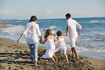 Image showing happy young  family have fun on beach