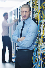 Image showing it engineers in network server room