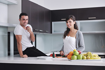 Image showing young couple have fun in modern kitchen