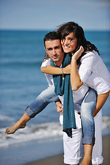 Image showing happy young couple have fun at beautiful beach