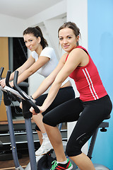 Image showing woman workout  in fitness club on running track 