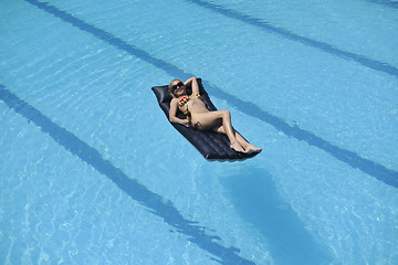 Image showing woman relax on swimming pool