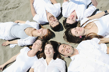 Image showing Group of happy young people in have fun at beach