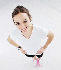 Image showing happy diet concept with young woman on pink scale