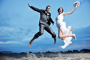 Image showing romantic beach wedding at sunset