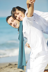 Image showing happy young couple have fun at beautiful beach