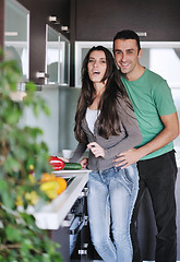 Image showing young couple have fun in modern kitchen