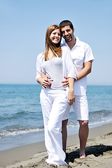 Image showing happy young couple have fun on beach