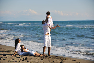 Image showing happy young  family have fun on beach