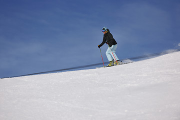 Image showing woman skiing on fresh snow at winter season 