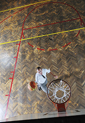 Image showing businessman holding basketball ball