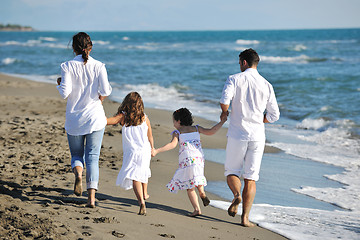 Image showing happy young  family have fun on beach