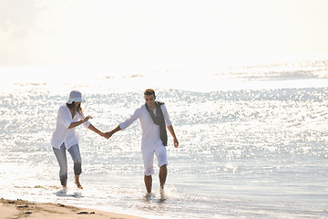 Image showing happy young couple have fun at beautiful beach