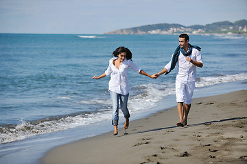 Image showing happy young couple have fun at beautiful beach