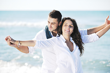 Image showing happy young couple have fun at beautiful beach