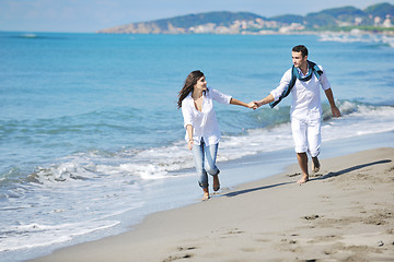 Image showing happy young couple have fun at beautiful beach