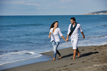 Image showing happy young couple have fun at beautiful beach