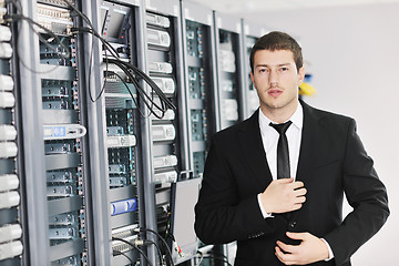 Image showing young it engeneer in datacenter server room