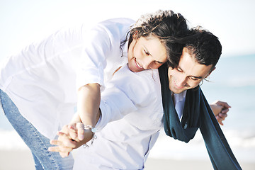 Image showing happy young couple have fun at beautiful beach