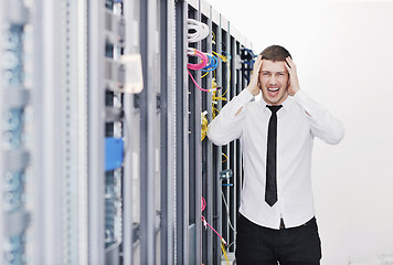 Image showing young it engeneer in datacenter server room