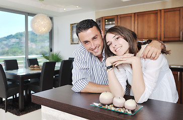 Image showing happy young couple have fun in modern kitchen