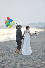 Image showing romantic beach wedding at sunset