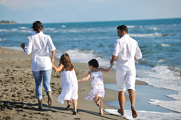 Image showing happy young  family have fun on beach